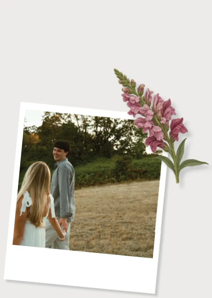 Max and Makayla holding hands in a field